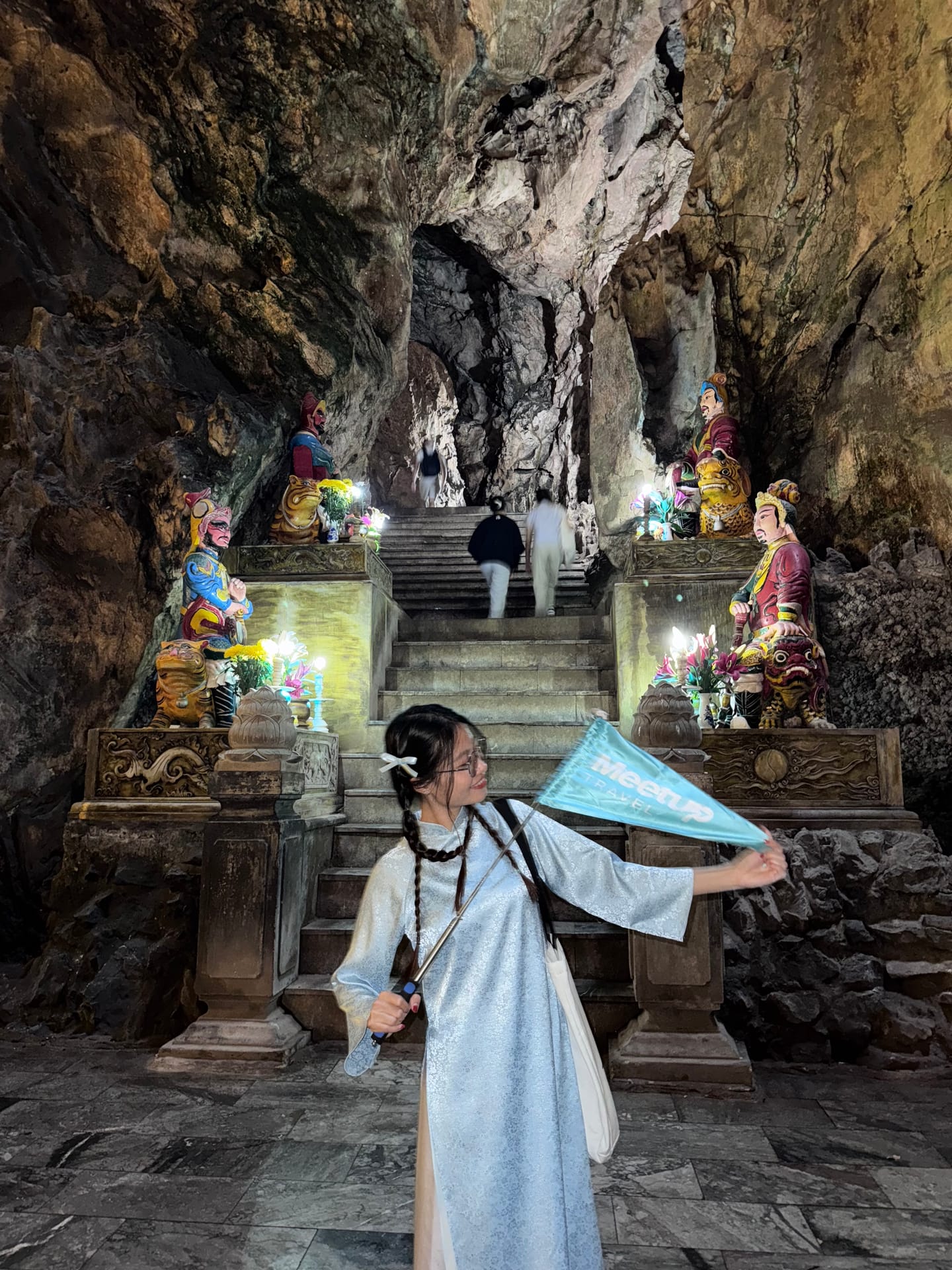 Cave entrance and Buddhist statues on the stone staircase at Marble Mountains, Da Nang