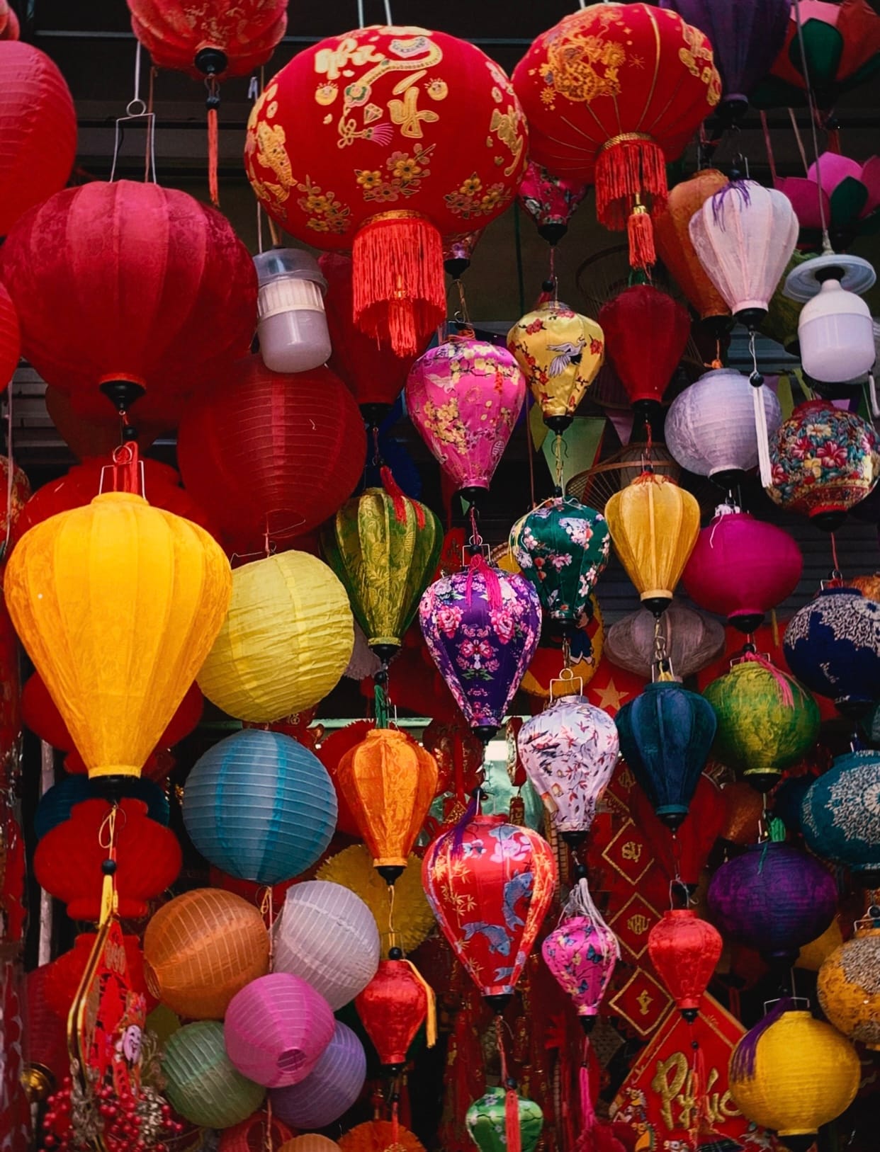 Rows of paper lanterns and craft goods fill the narrow storefronts of Hang Ma Street.