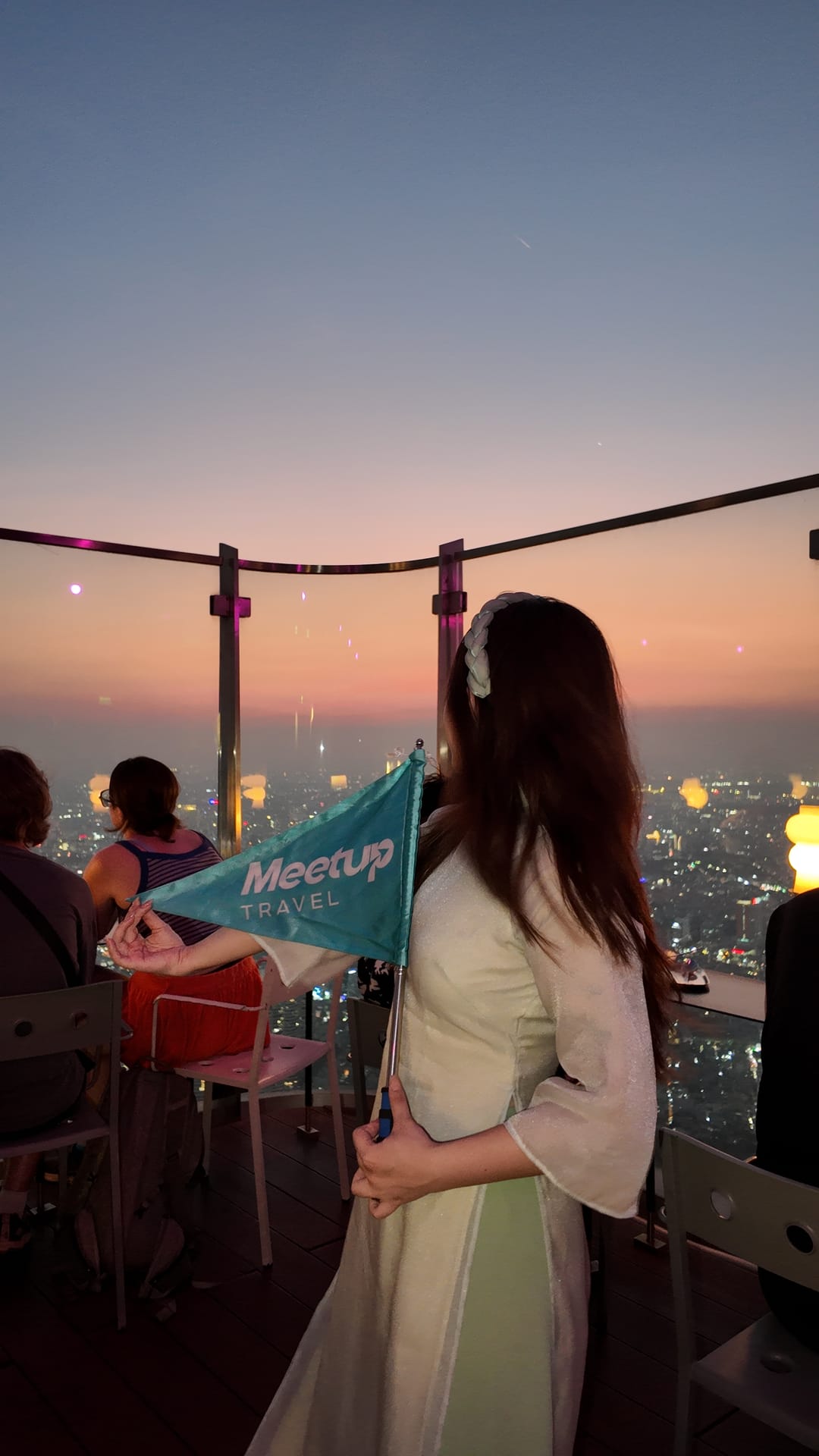A Meetup Travel guide with guests on a Ho Chi Minh City street