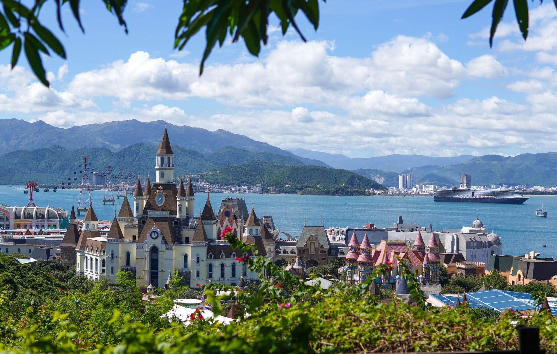 Panoramic view of VinWonders castle architecture overlooking the coastal bay and mountains in Nha Trang Vietnam