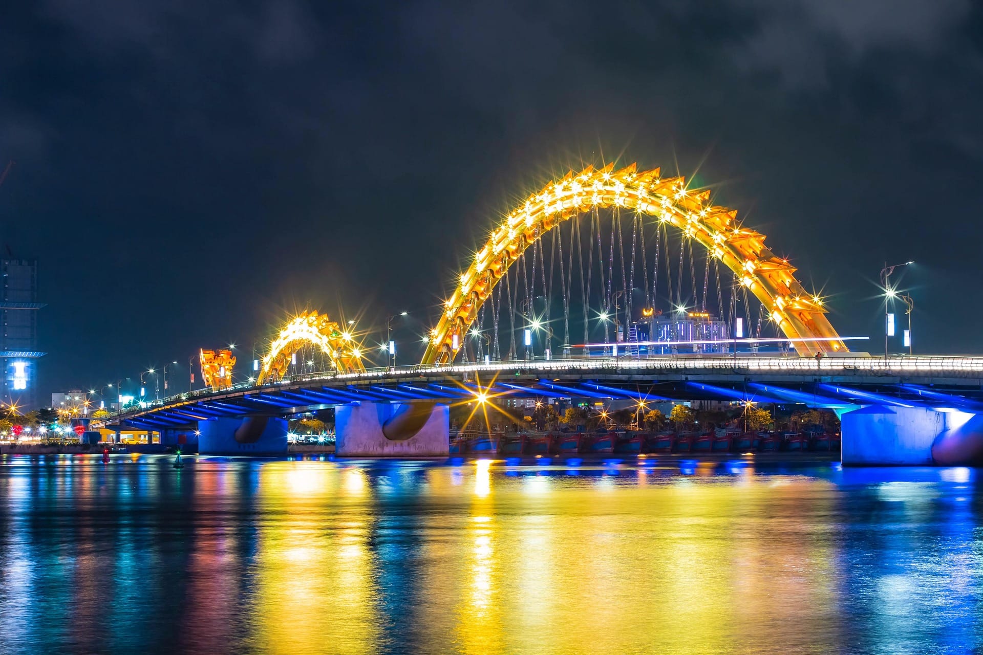 Dragon Bridge lit up at night over the Han River in Da Nang