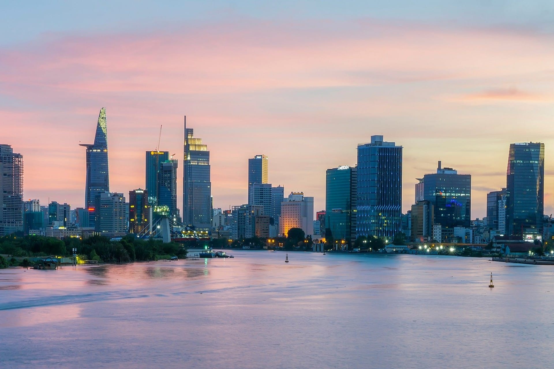 Ho Chi Minh City skyline with dark storm clouds building over the buildings in late afternoon light