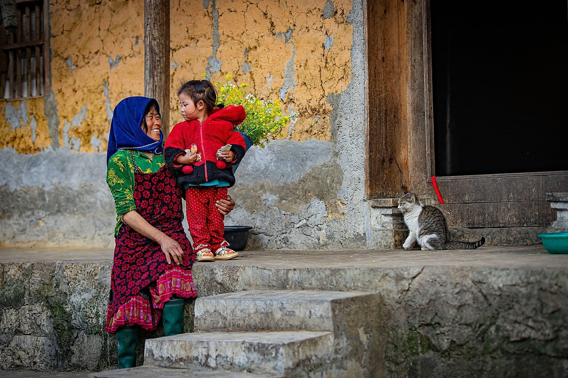 Ethnic Hmong mother and child in colorful traditional clothes in Bac Ha