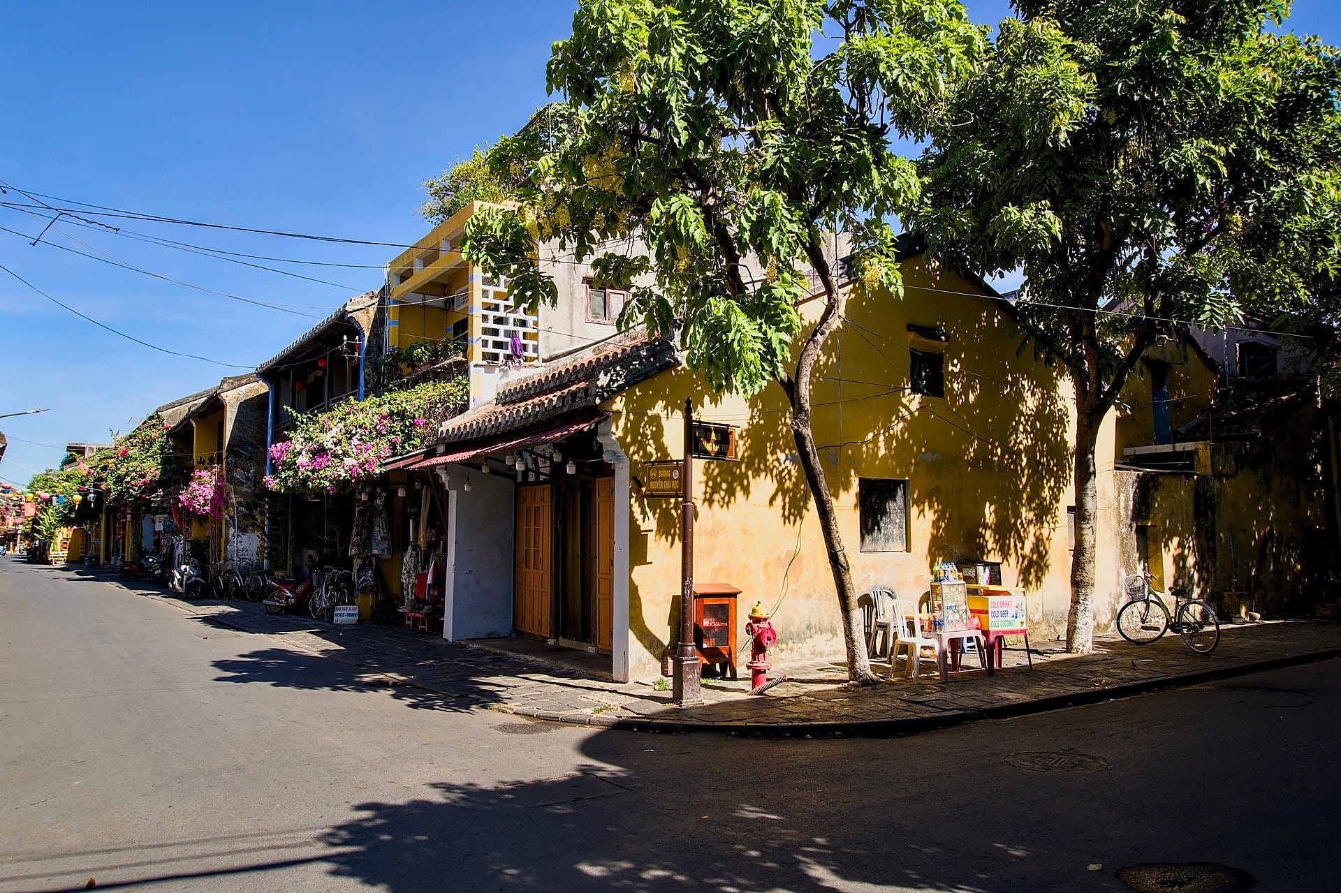 Ochre shophouses on a quiet street in Hoi An ancient town