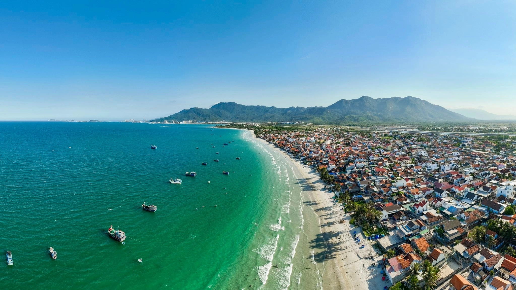 Aerial view of Doc Let white sand beach and coastal town north of Nha Trang