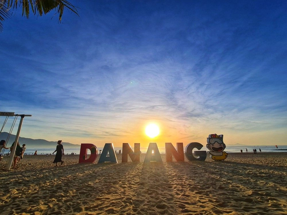 Sunrise over the ocean horizon at Da Nang beach Vietnam